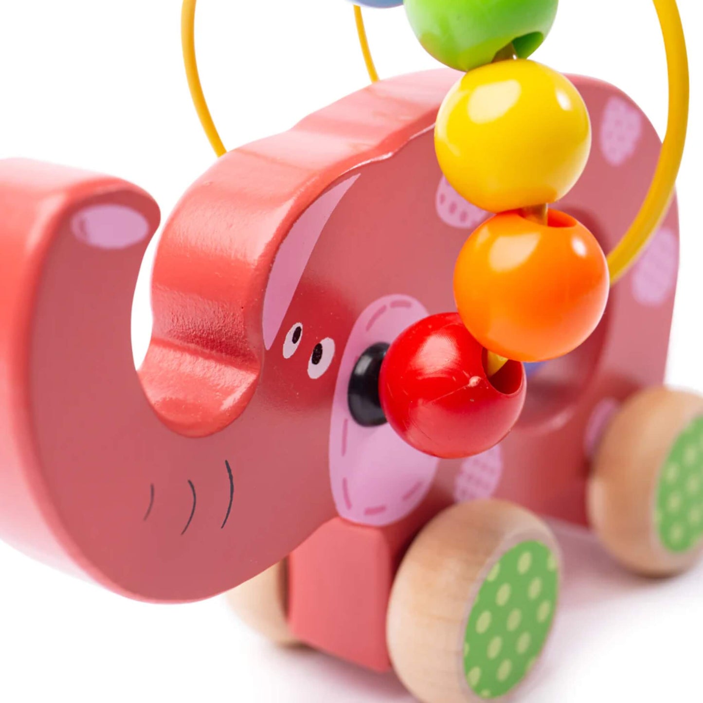 Close-up of the red and pink wooden elephant toy showing its painted face, yellow bead wire, and colourful beads in red, orange, yellow, and green.