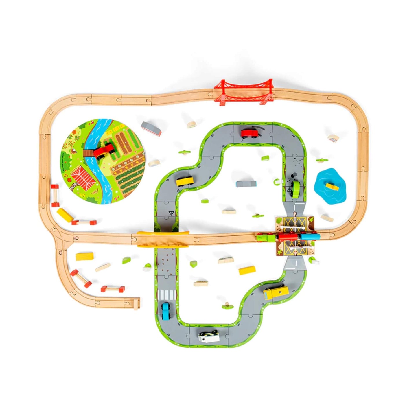 Top-down view of the entire Train Set, with wooden train tracks looping around a plastic road system, farm mat, and accessories like cars, trucks, and trees.