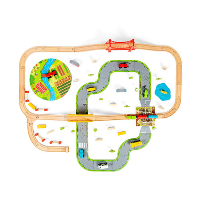 Top-down view of the entire Train Set, with wooden train tracks looping around a plastic road system, farm mat, and accessories like cars, trucks, and trees.