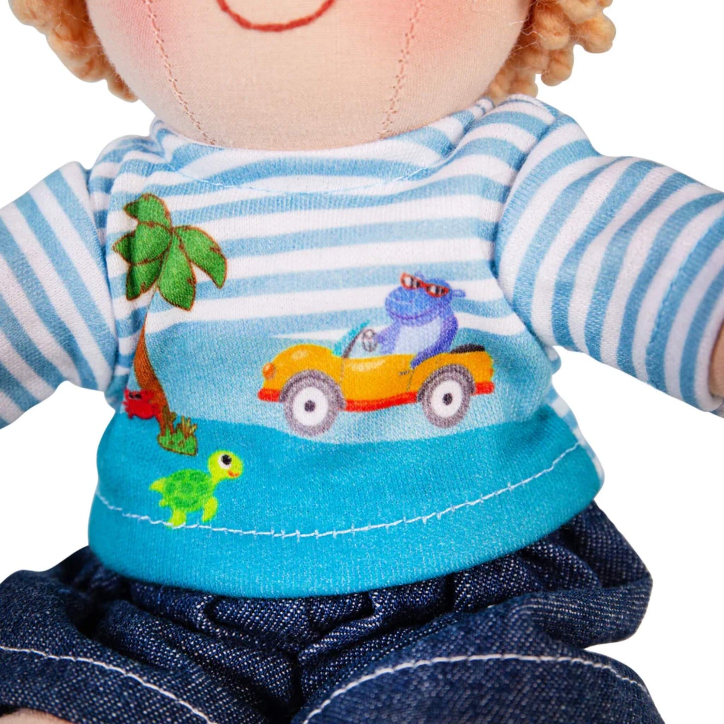 Detailed view of the seaside print on the Robin doll's striped t-shirt showing a hippo in a beach buggy and a small turtle.