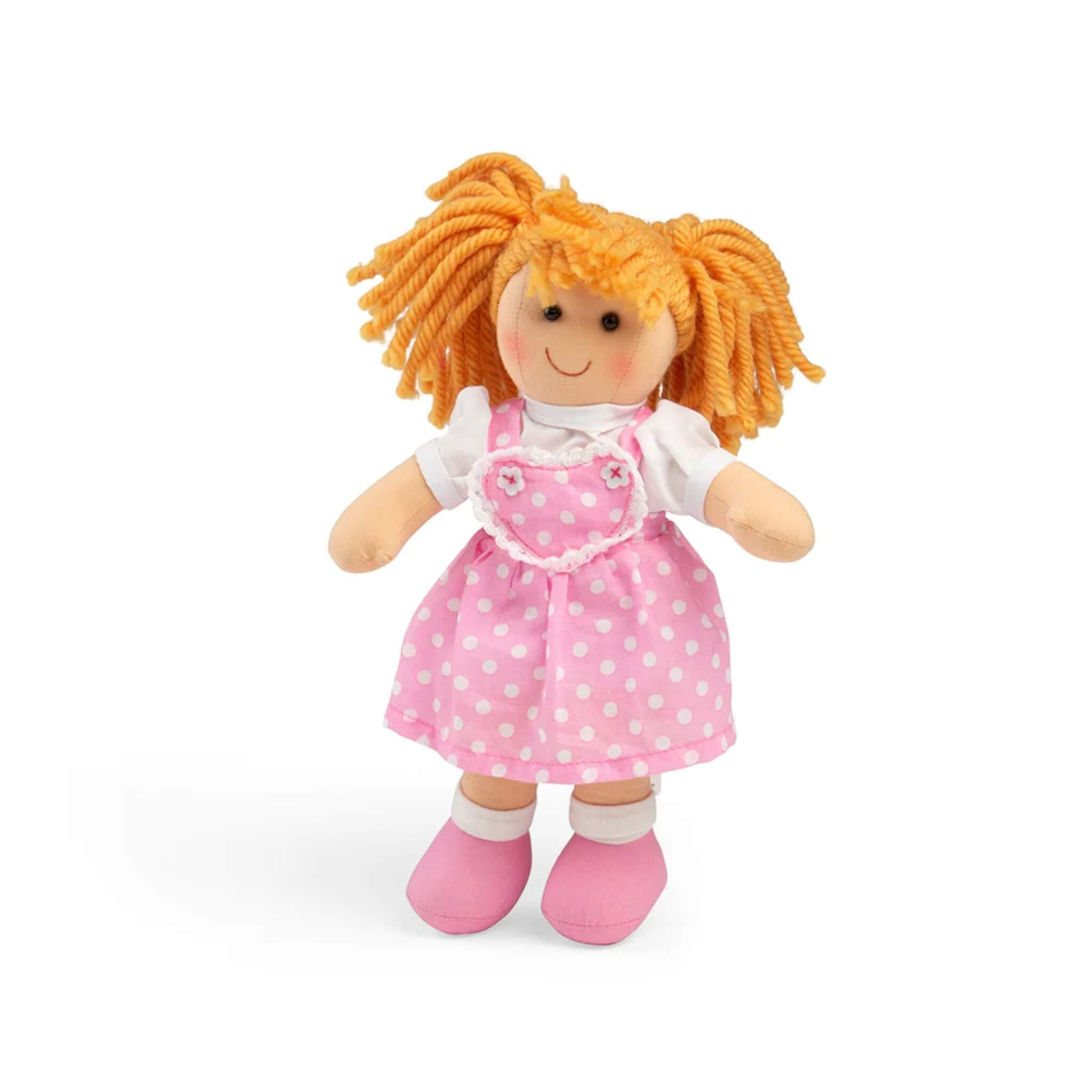 Bigjigs Toys Ruby Doll Small wearing a pink polka dot dress with heart-shaped bodice, white blouse and pink shoes, shown standing upright.