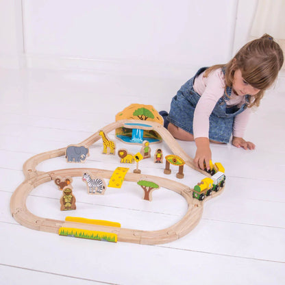 Child pushing the safari train around the track, exploring different features of the playset.
