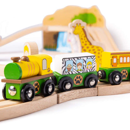 Wooden safari train with zebra-print carriage and yellow engine featuring animal paw print wheels, travelling along the curved track.