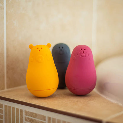 Bigjigs Silicone Bath Buddies set displayed beside a bath on tiled bathroom edge, ready for play.