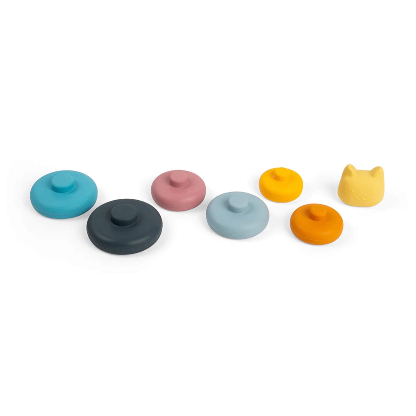 All seven pieces from the Bigjigs Toys Silicone Stacking Cat toy laid out side by side, including six rounded silicone rings and the cat head topper.