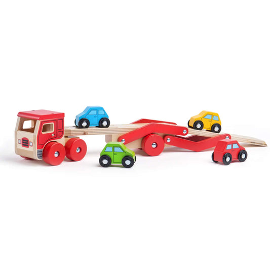 Bigjigs Toys Wooden transporter lorry with four colourful cars on and around its detachable ramp, against a plain backdrop.