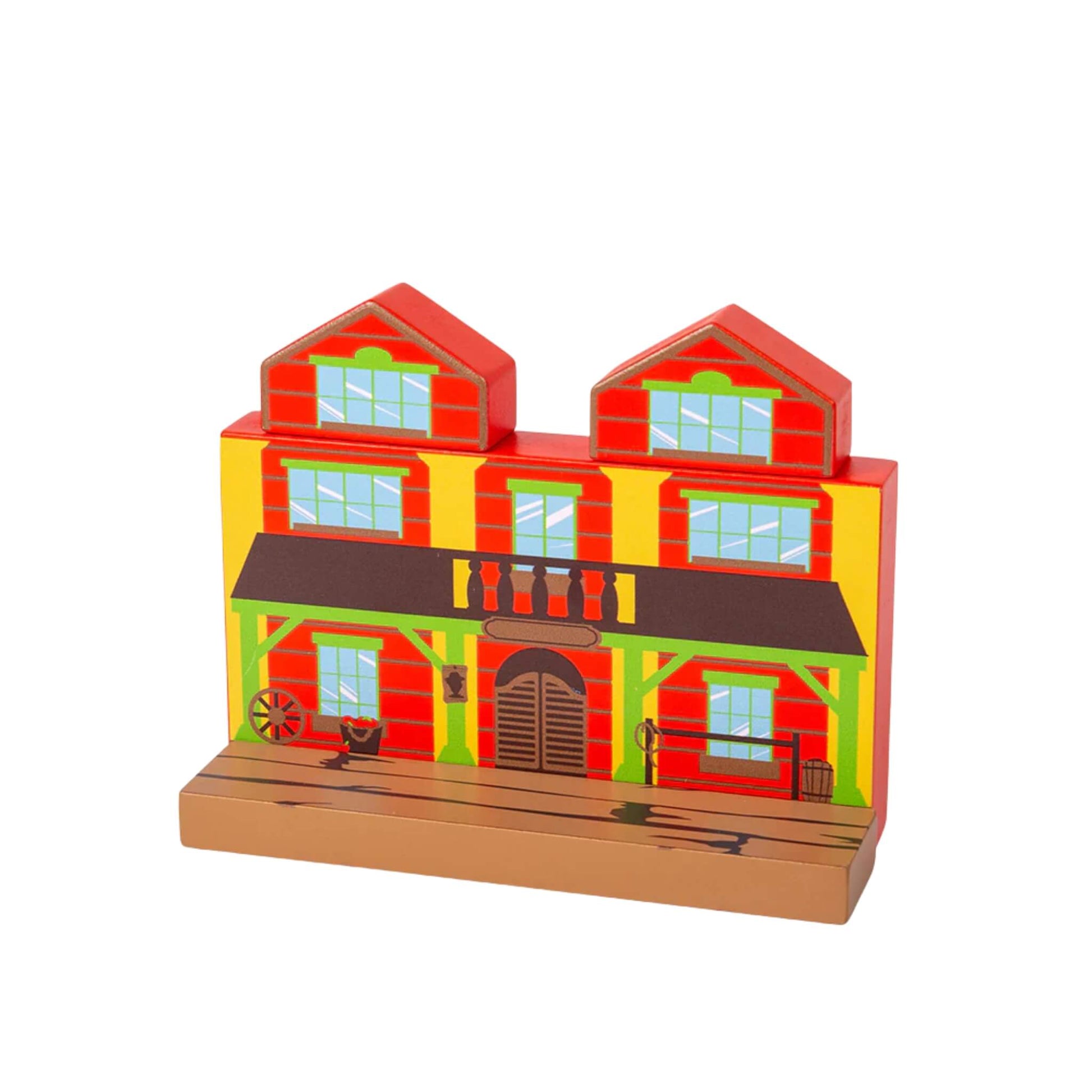 Wooden Wild West saloon building from the Bigjigs Toys Wild West Train Set with a red and yellow facade, swinging doors, and balcony detail.