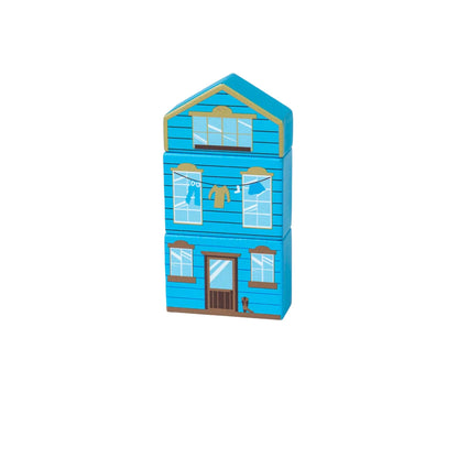 Tall blue wooden town building with clothesline detail from the Bigjigs Toys Wild West Train Set, made from three stacked blocks.