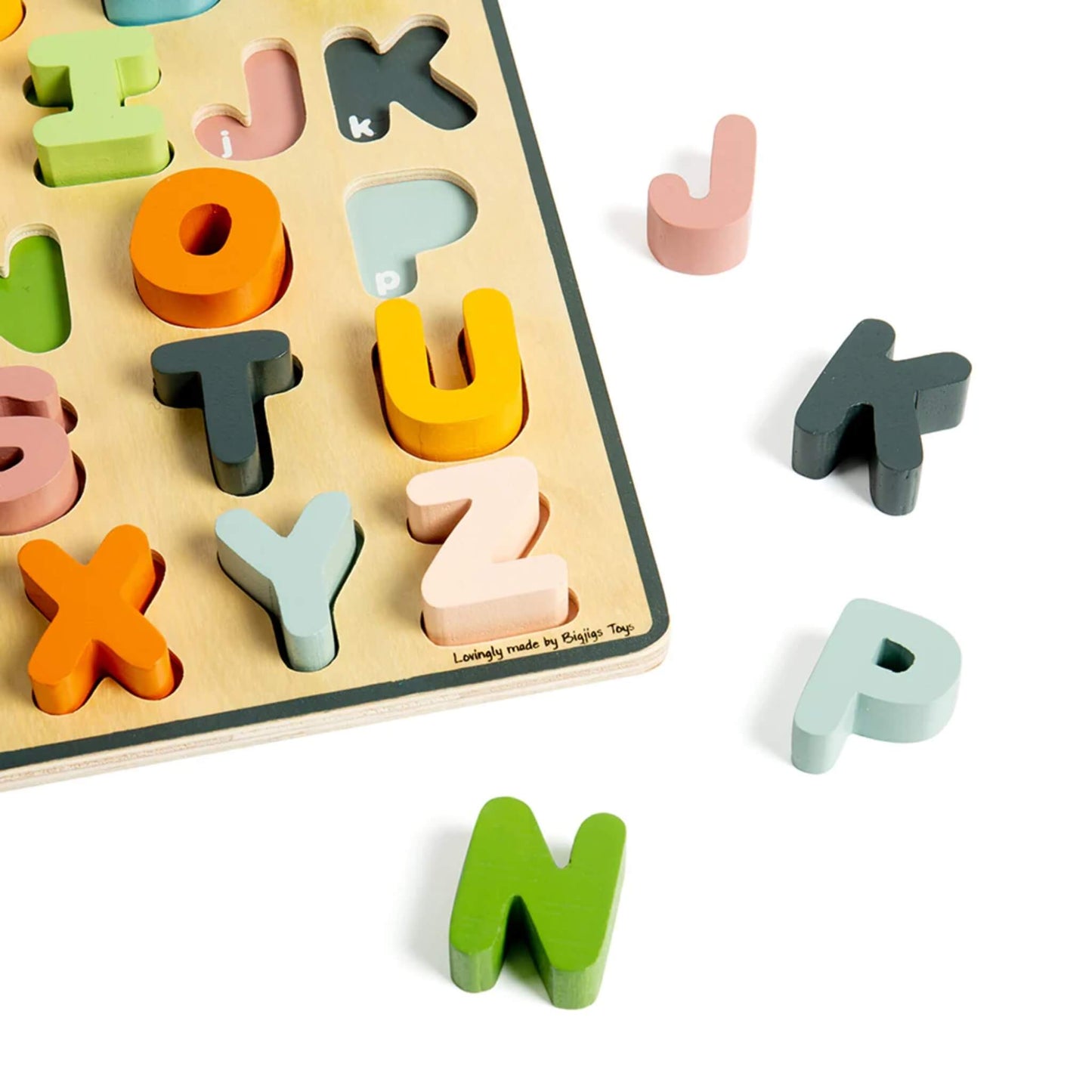 Close-up of pastel wooden letters on the alphabet puzzle, showing matching slots and bright, child-friendly colours.