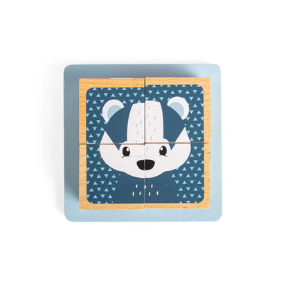 Top-down view of the wooden cube puzzle forming a completed badger face, neatly arranged in the blue puzzle tray.