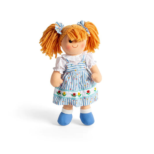 A soft and cuddly ragdoll and she wears her very own blue striped dress that matches the hair ties in her hair.