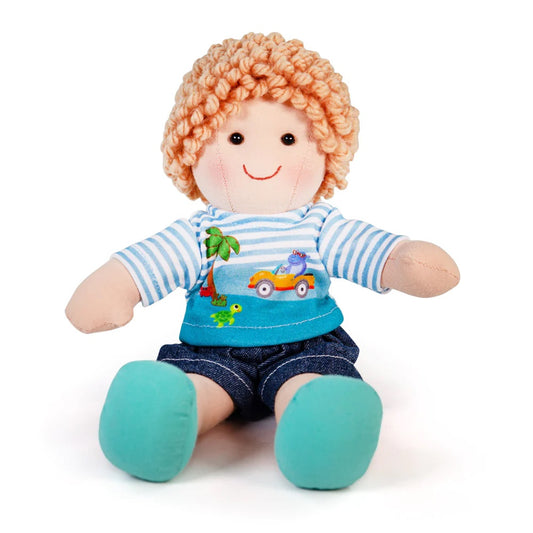 A soft and cuddly Bigjigs ragdoll dressed in an adorable outfit. With curly hair and wearing a striped top with a beach design, denim shorts and blue shoes.
