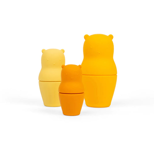 The Bigjigs Nesting Bears are an adorable and eco-friendly addition to a plastic-free playroom. This set of nesting dolls consists of three bears in ombre shades, offering a charming nursery decoration and a developmental toy for babies.
