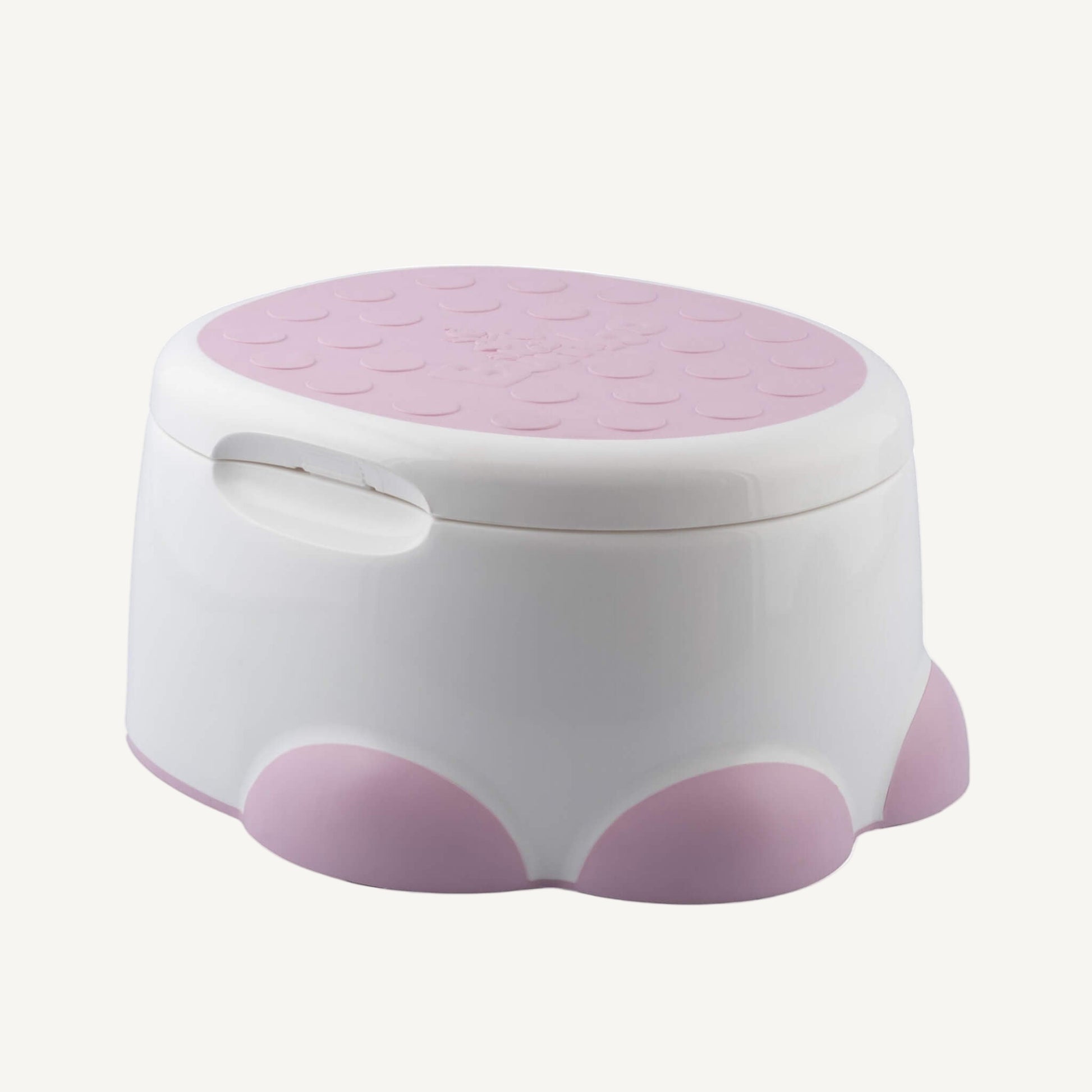 Bumbo Step ‘n Potty in Cradle Pink with lid closed, ready for use as step stool.