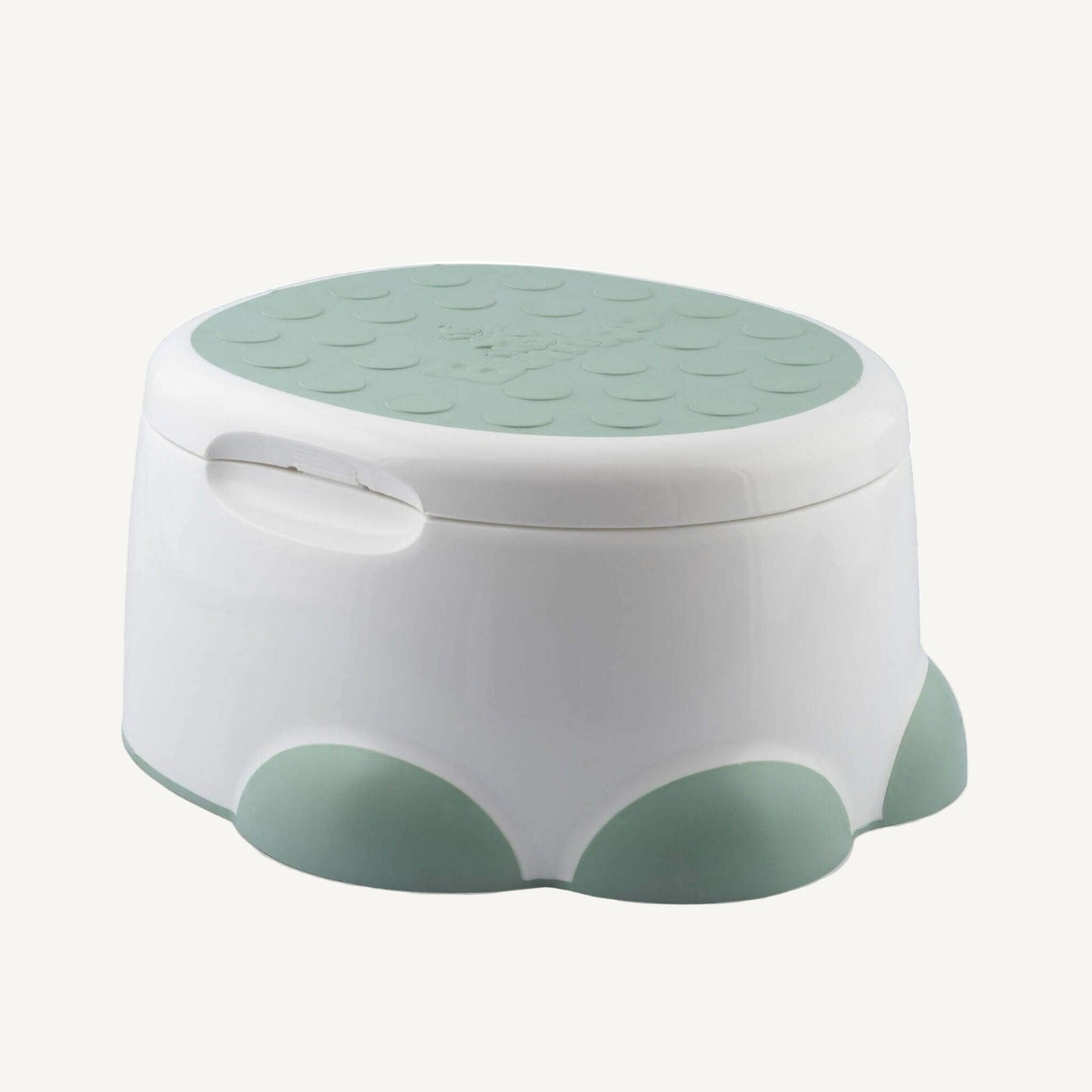 Same Step 'n Potty shown with lid closed in step stool mode, featuring a green textured top for grip.