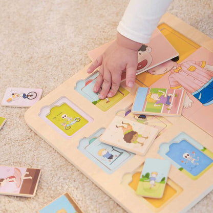 Child’s hand placing a wooden tile into a puzzle board, surrounded by other small puzzle pieces on a soft carpet.