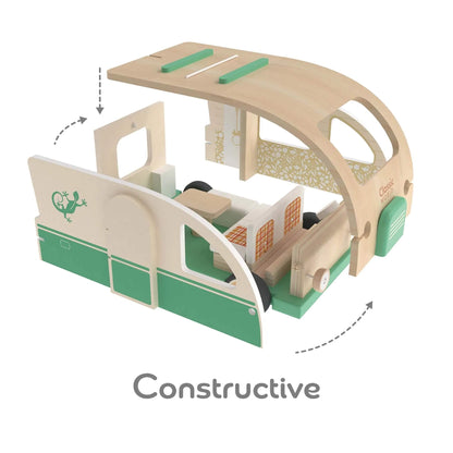 A disassembled view of a wooden toy campervan with the roof and side panels lifted off, revealing the kitchen, seating area, and other interior details.