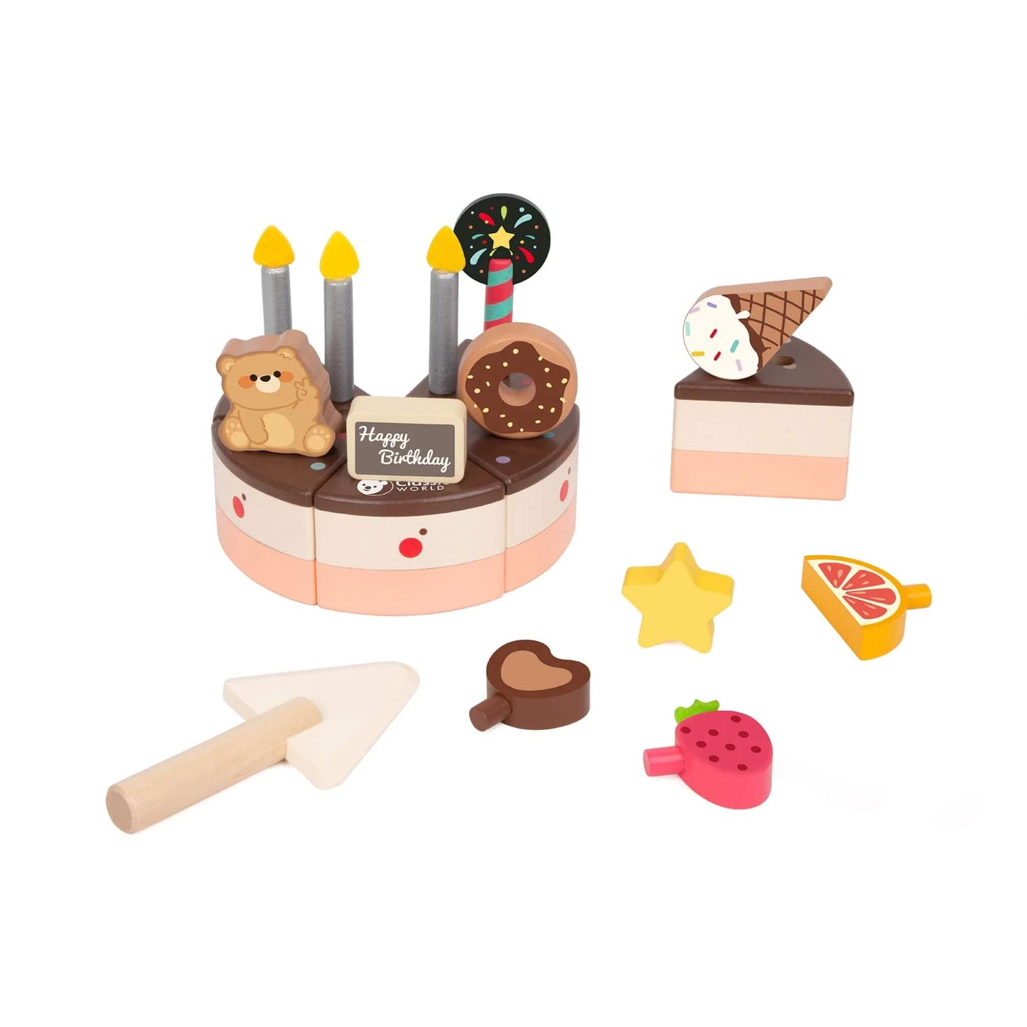 A wooden toy chocolate cake with one slice removed, surrounded by small wooden toppings like a star, strawberry, and heart, plus a wooden cake knife.