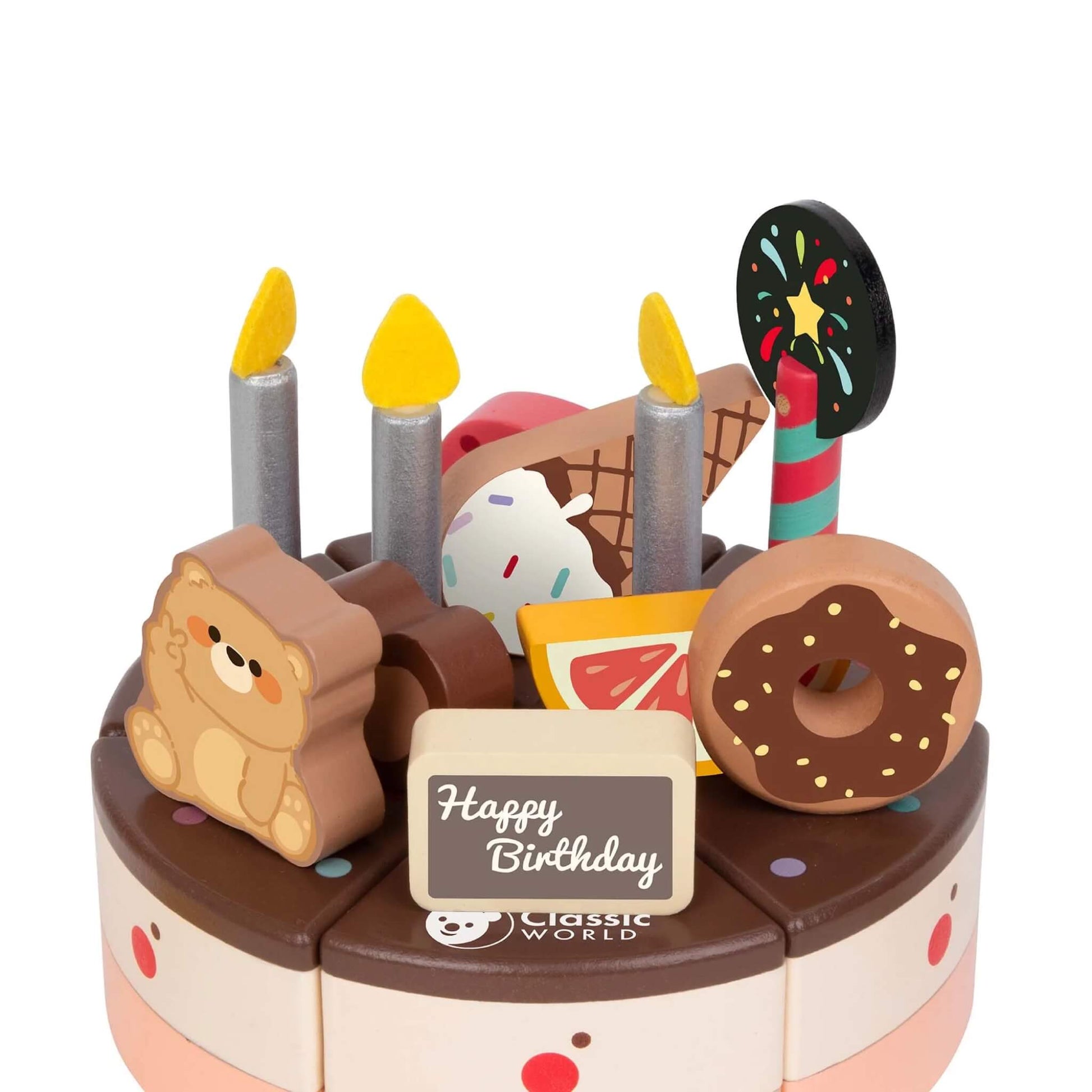 Close-up of the toy chocolate cake’s top, showing details like a bear-shaped topper, donut, ice cream cone, lollipop, and “Happy Birthday” sign.