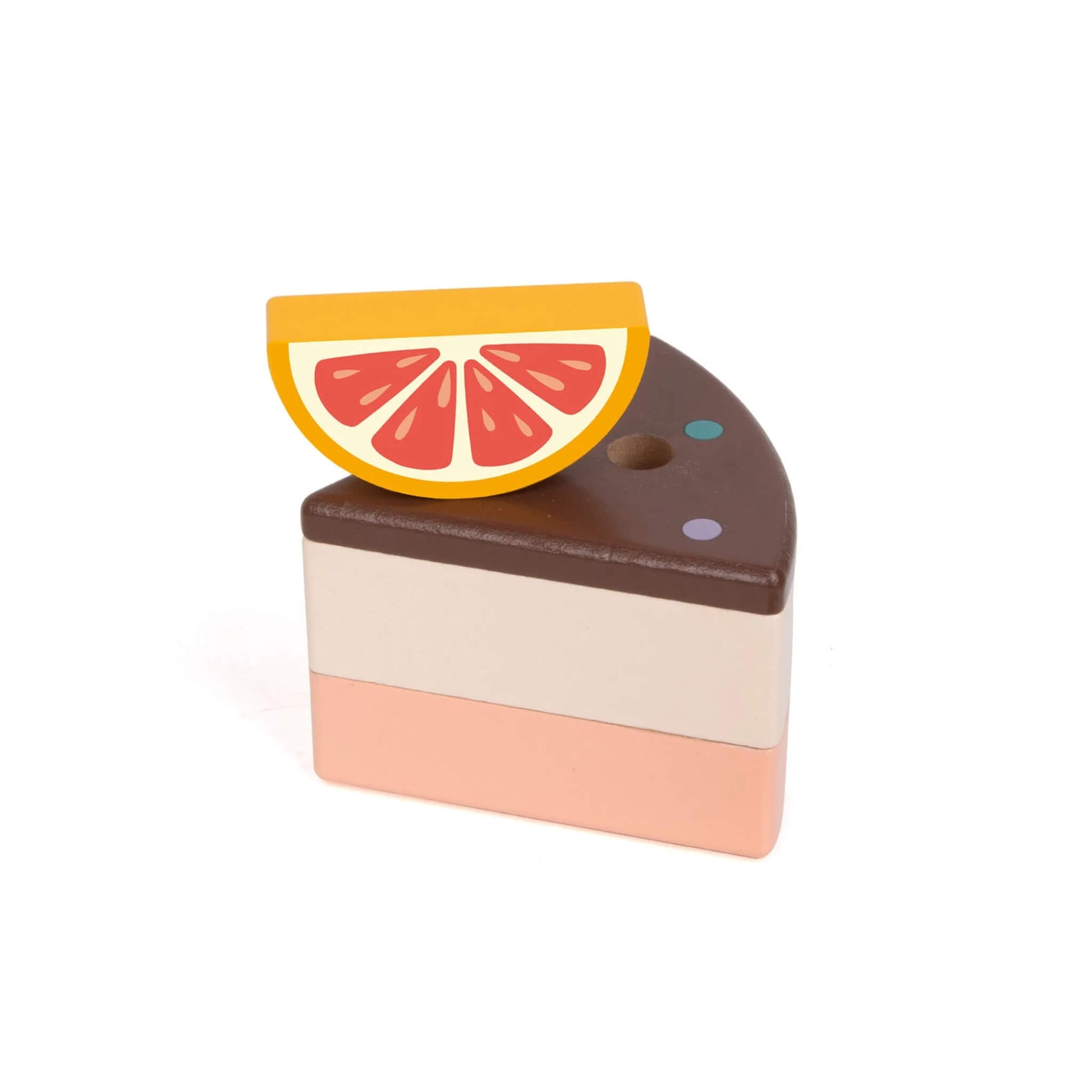 A single wooden cake slice with a grapefruit-style wooden fruit topper, showing layered chocolate, cream, and pink sections.