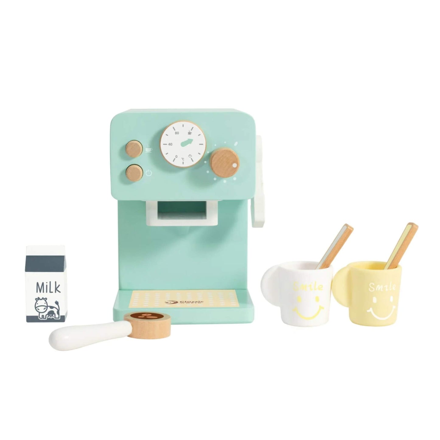 Classic World Coffee Maker set with mint green wooden machine, two smiling mugs, a milk carton, spoon, and coffee pod displayed neatly.