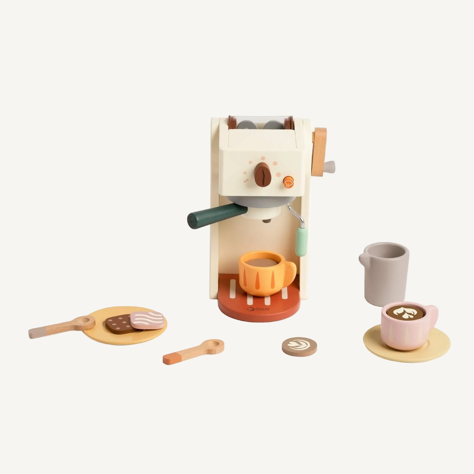A wooden toy coffee machine with a portafilter attached and a small cup placed underneath, surrounded by play biscuits and utensils.