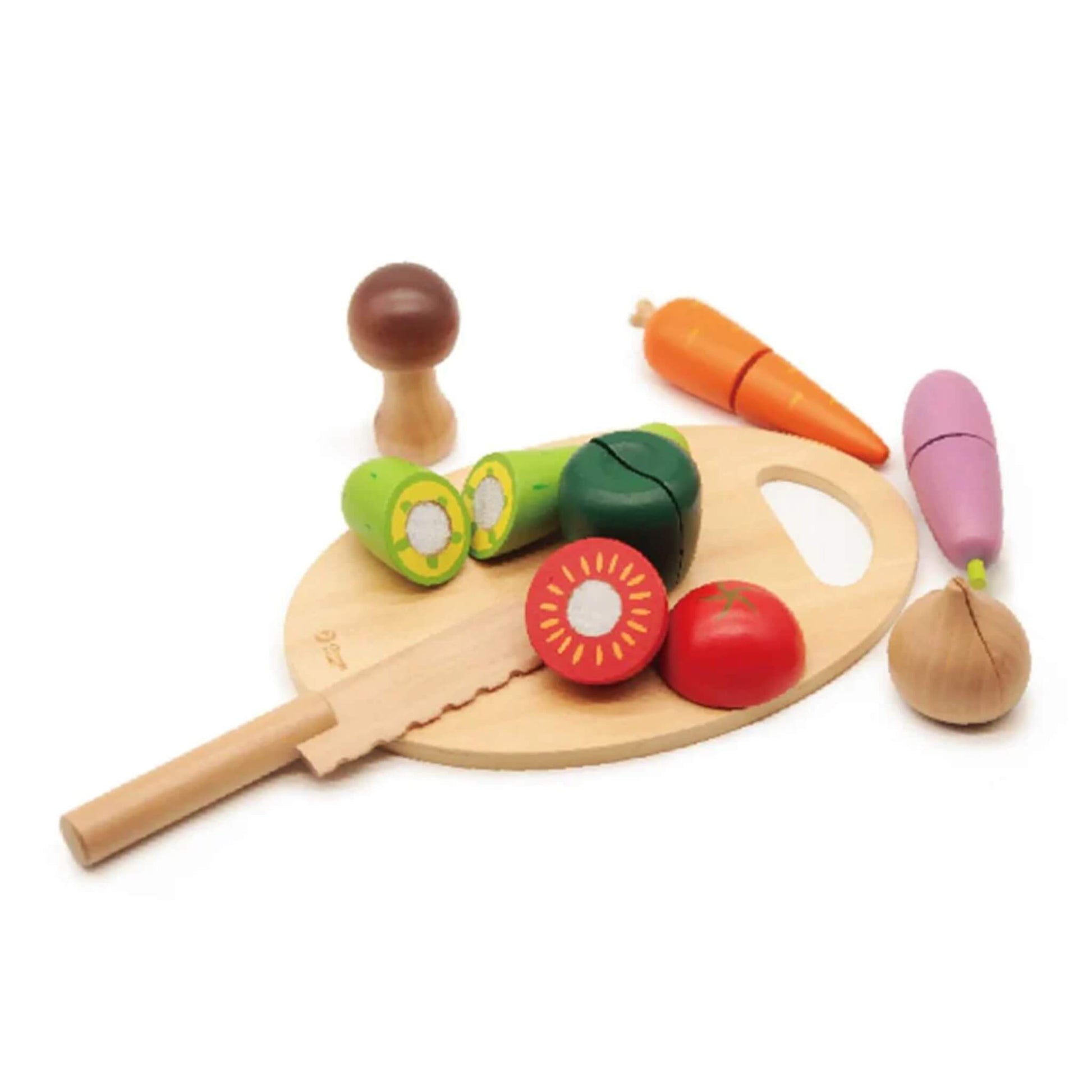 Wooden play cutting board with toy vegetables, sliced apart to reveal Velcro centres, showing carrot, cucumber, pepper, eggplant, tomato, and mushroom.