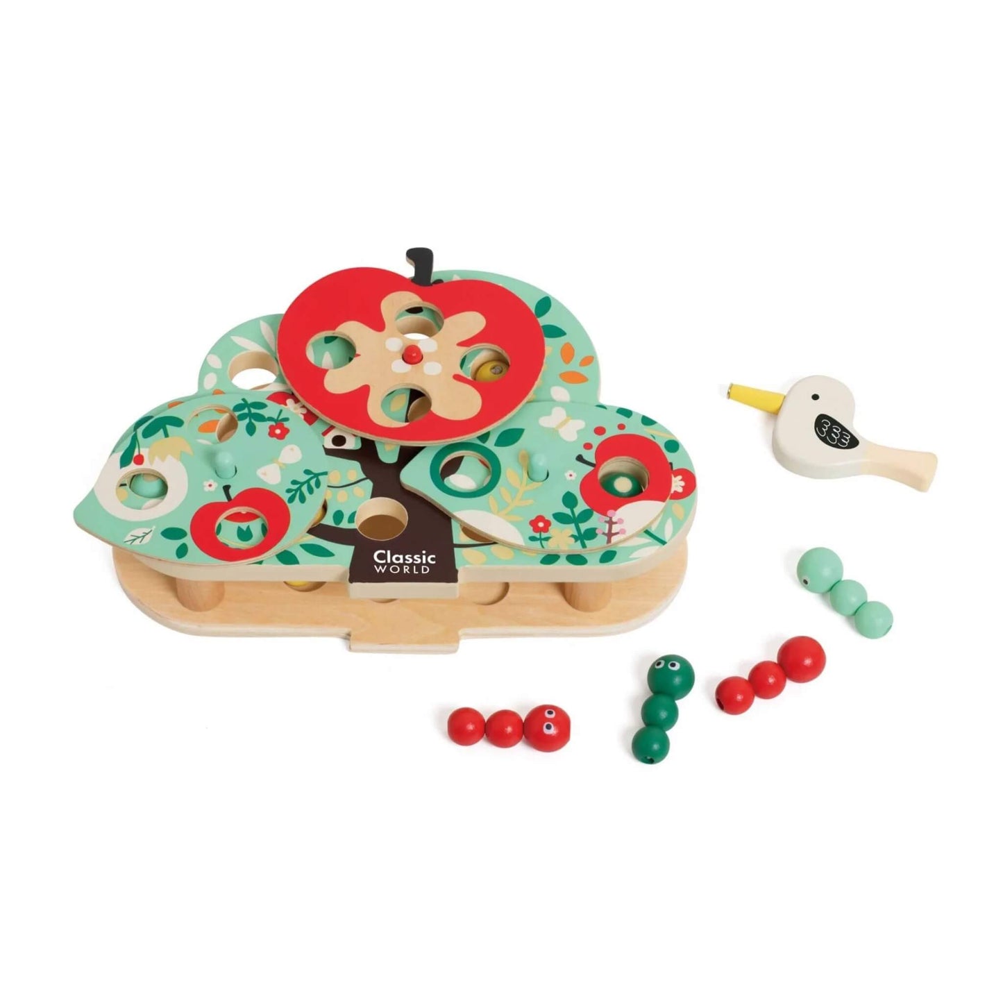 Wooden tree-shaped toy with red apple slice on top, scattered caterpillar pieces, and a small wooden bird tool placed to the side.