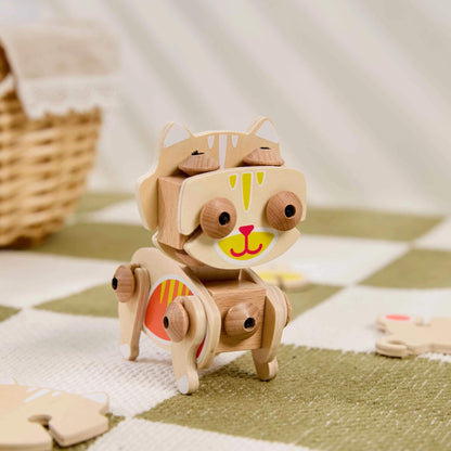 Wooden animal construction toy with flexible joints standing upright on a patterned play mat showing movable limbs and painted facial details.