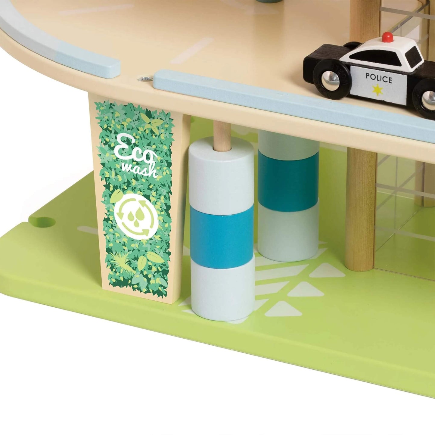 Ground-level view of a wooden eco garage showing an “Eco Wash” sign with leaf designs and blue-and-white car wash rollers.
