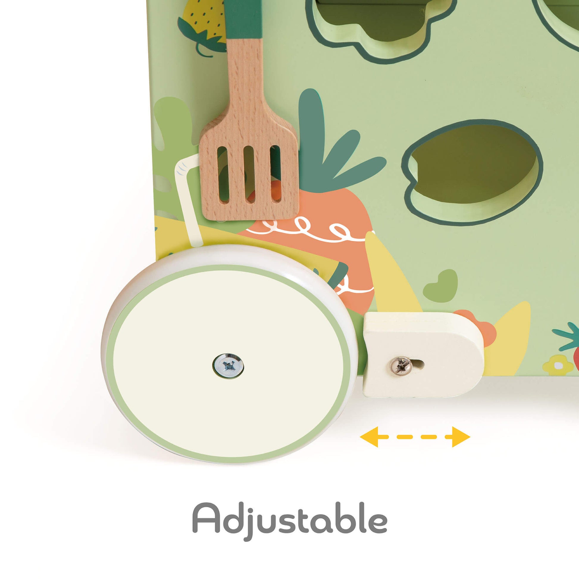 Close-up of a green rubber tyre wheel attached to a wooden walker base, with an adjustable tension dial and hanging spatula.