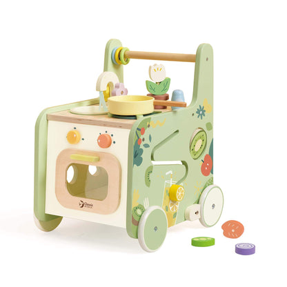 Classic World Kitchen Walker, a pastel wooden 2-in-1 walker with play kitchen, shape sorter, and maze, with toy food pieces and accessories.