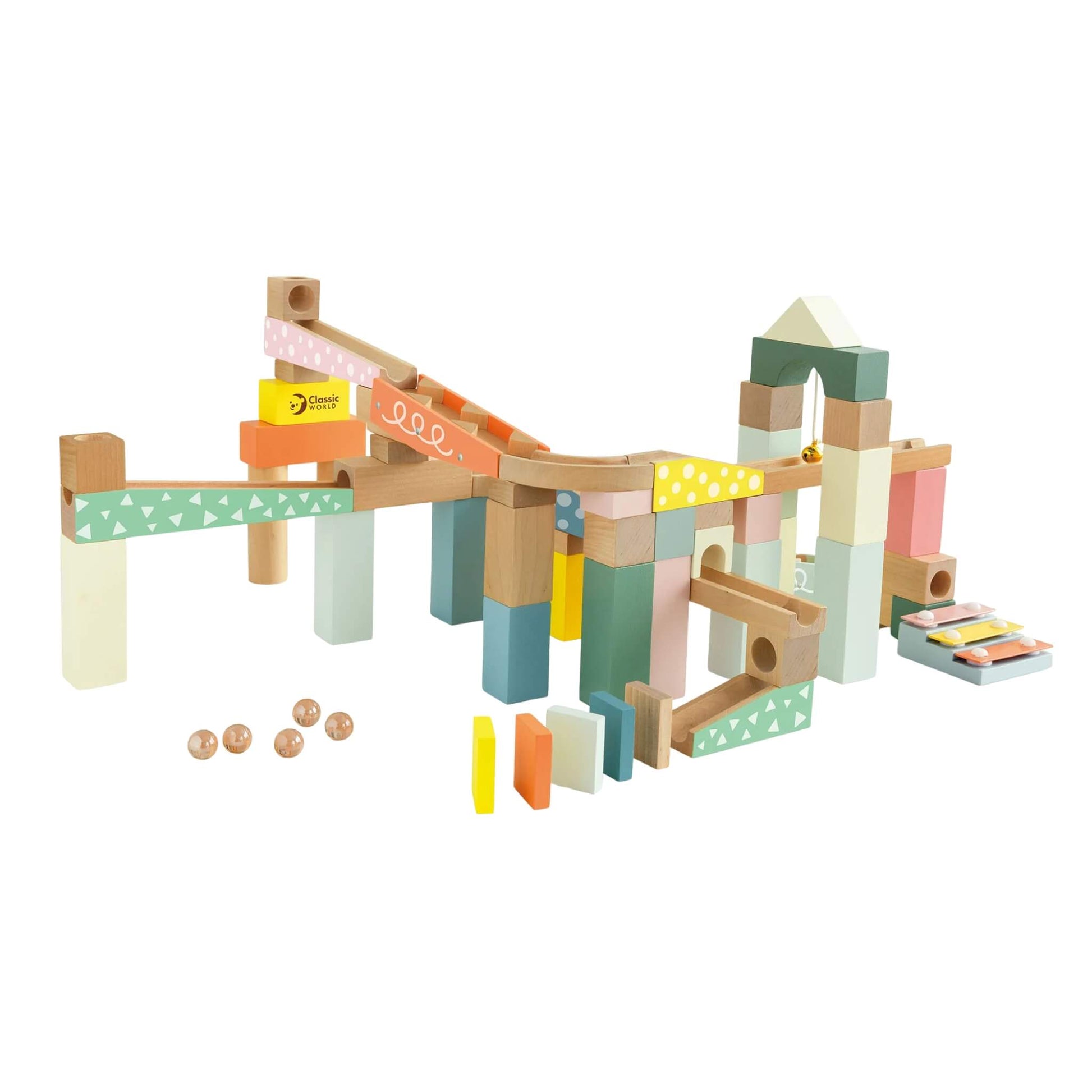 A colourful Classic World Marble Blocks set built into a tall track with marbles rolling down ramps, past dominoes and musical notes.
