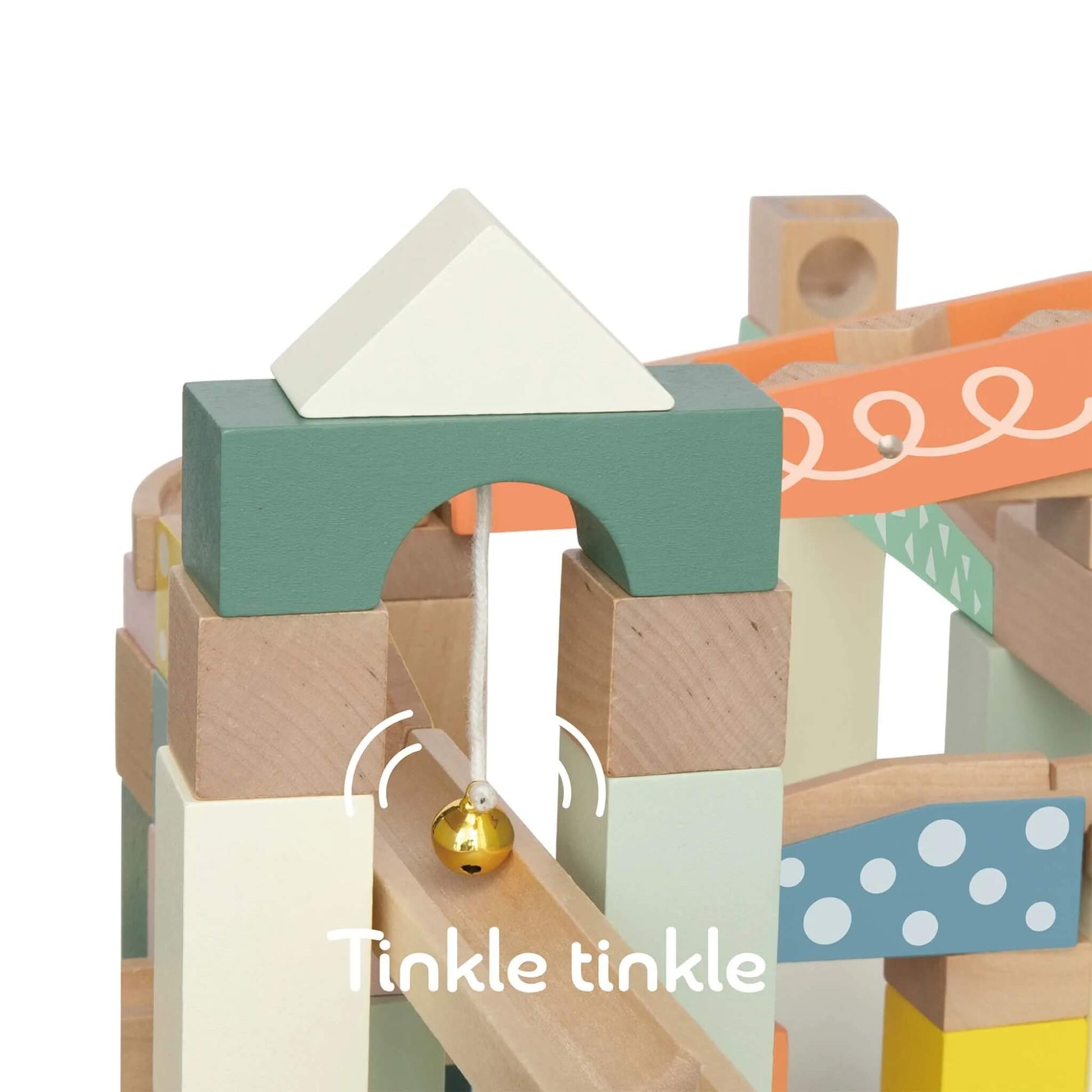Close-up of the top archway from a set of wooden blocks with a gold bell hanging and pastel-colours.