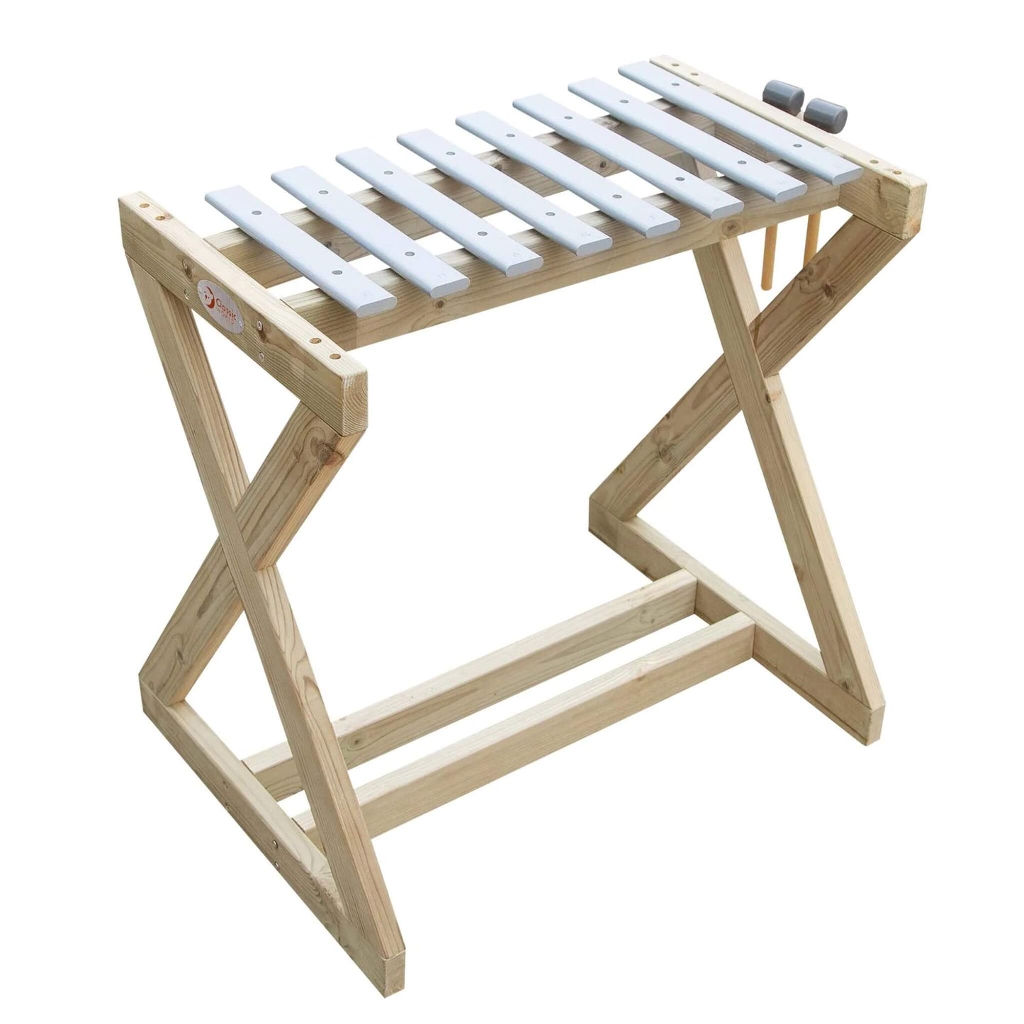 Side view of a wooden metallophone with metal keys and two wooden mallets resting on top.