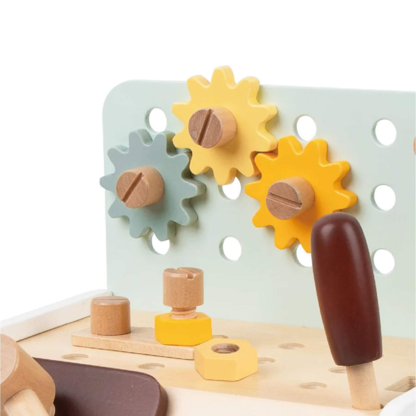Close-up of pastel yellow, orange, and blue wooden gears attached to pegboard, with wooden bolts nearby.