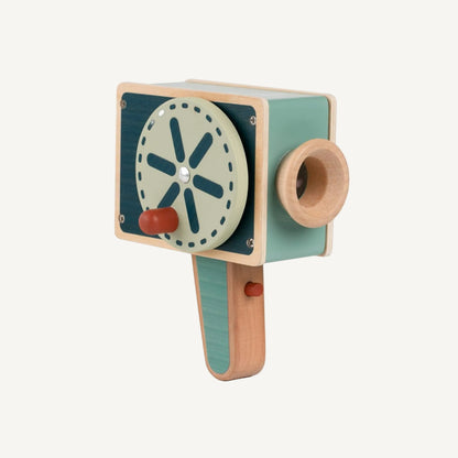 Wooden pretend play movie camera toy showing rear view with rotating reel handle, viewfinder lens and teal and natural wood finish.