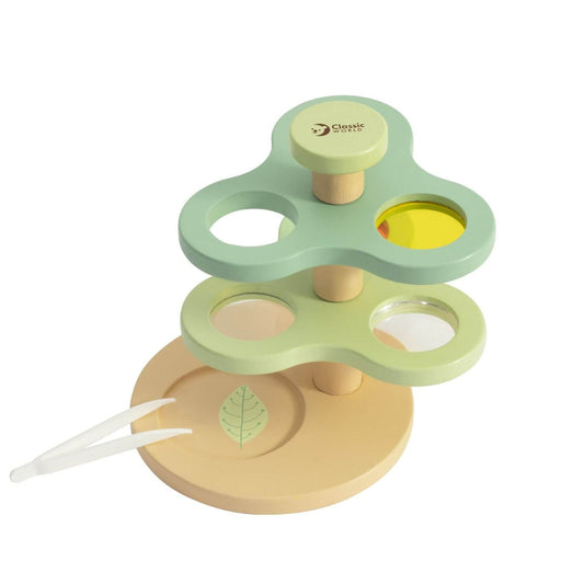 Wooden natural exploration set with magnifying lenses, prism, and tweezers, perfect for children to explore nature and light properties.