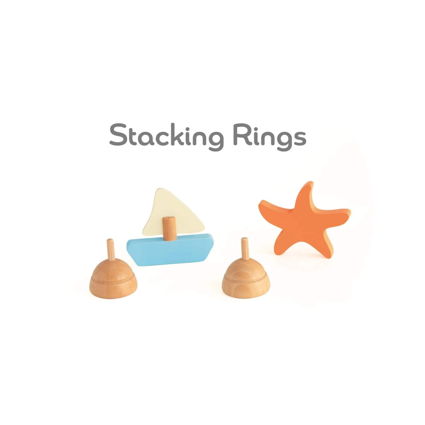 Stacking ring pieces shaped like a sailboat and starfish, displayed as part of the wooden ocean domino set.