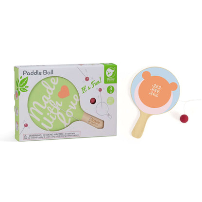 Classic World Paddle Ball set showing the toy’s packaging alongside an alternate paddle with a bear face design in soft pastel colours.