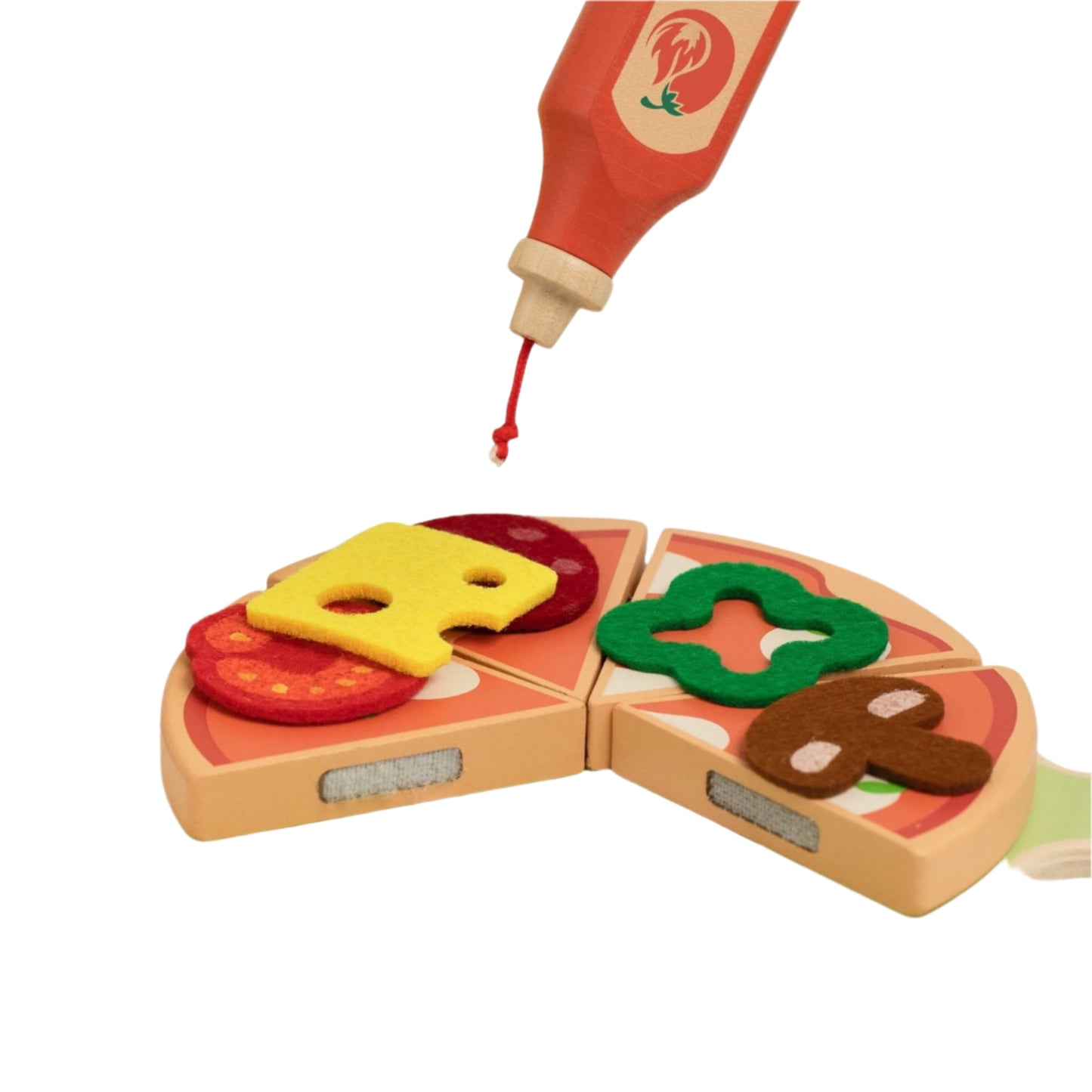 Close-up of toy wooden pizza slices with colourful felt toppings and a bottle of pretend sauce for imaginative play.