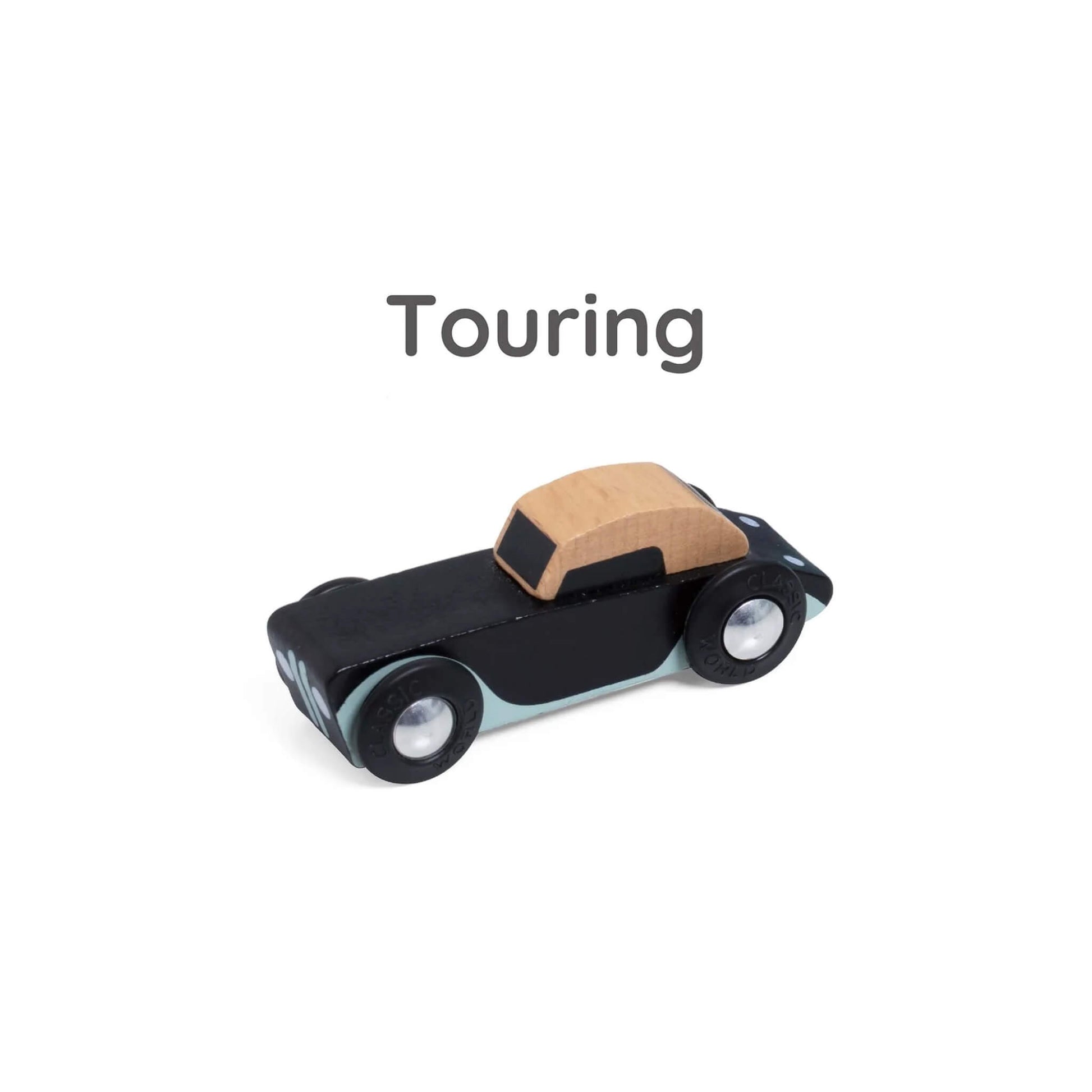 Close-up of black wooden toy convertible labelled “Touring” above, showing natural wood roof and soft blue trim.