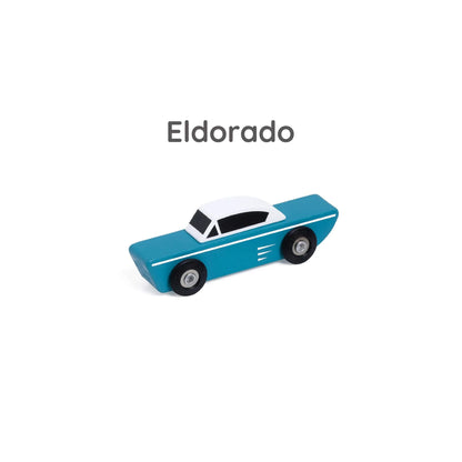 Close-up of blue wooden toy coupe labelled “Eldorado” above, with white roof and vintage detailing.