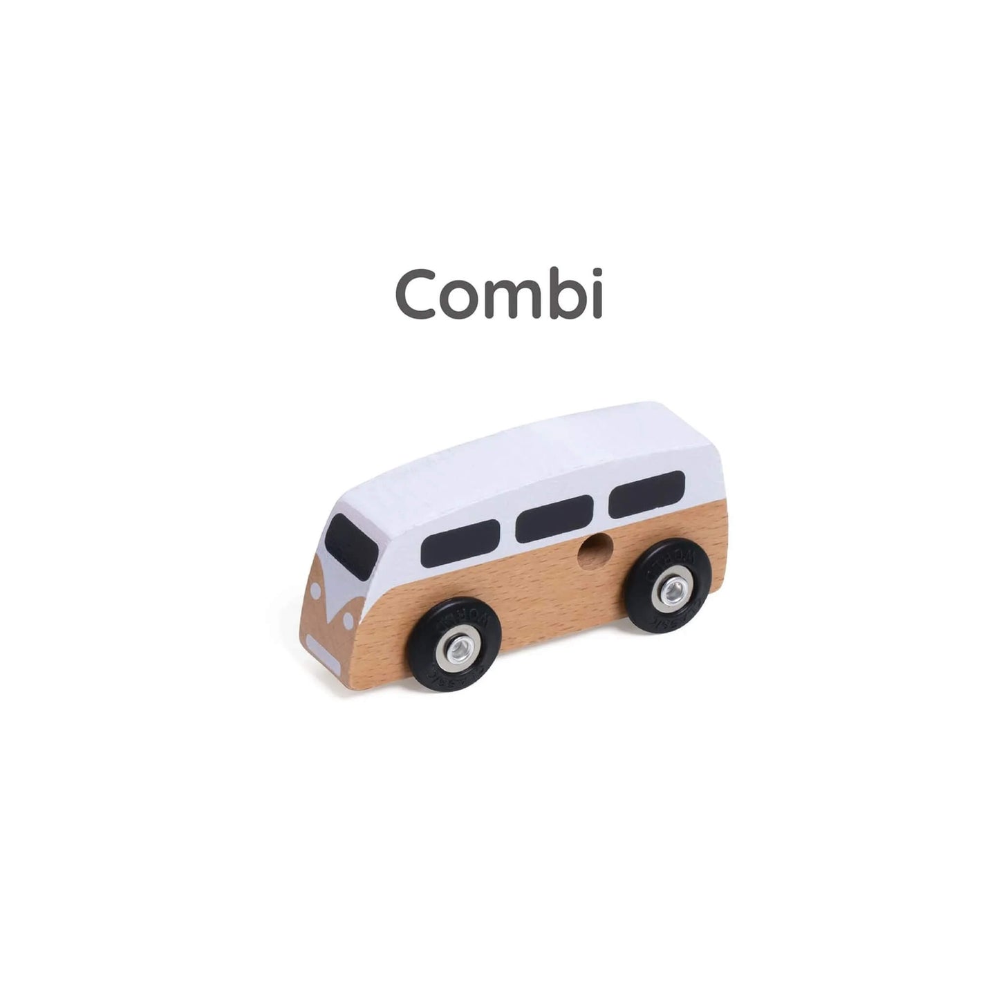 Close-up of white wooden toy camper van labelled “Combi” above, with natural wood lower half and black window shapes.