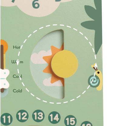 Detail of a circular slider showing a yellow sun and dark sky to represent day and night transitions on a wooden calendar board.