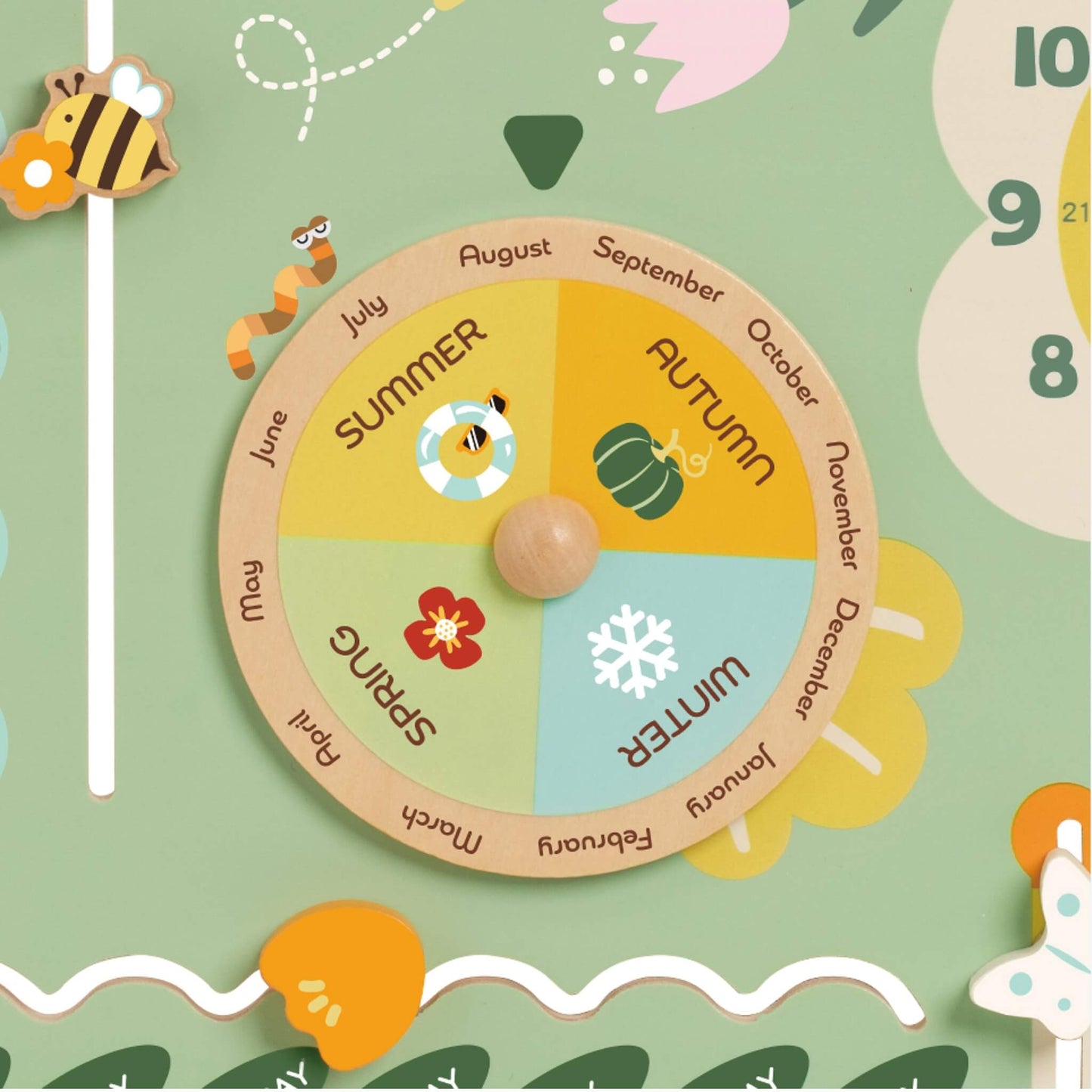Wooden season wheel with sections for spring, summer, autumn, and winter, each illustrated with colourful icons like flowers and snowflakes.