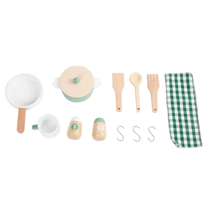 A flat lay of toy kitchen accessories includes a pot with lid, frying pan, cup, salt and pepper shakers, utensils, hooks, and a green gingham cloth.
