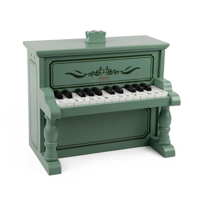 Toy wooden vintage-style piano in green with intricate decorative details. Compact design, perfect for introducing music to children.