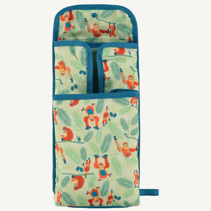 A changing mat opened to reveal internal pockets and sections, all lined in the orangutan print for storing small changing essentials.