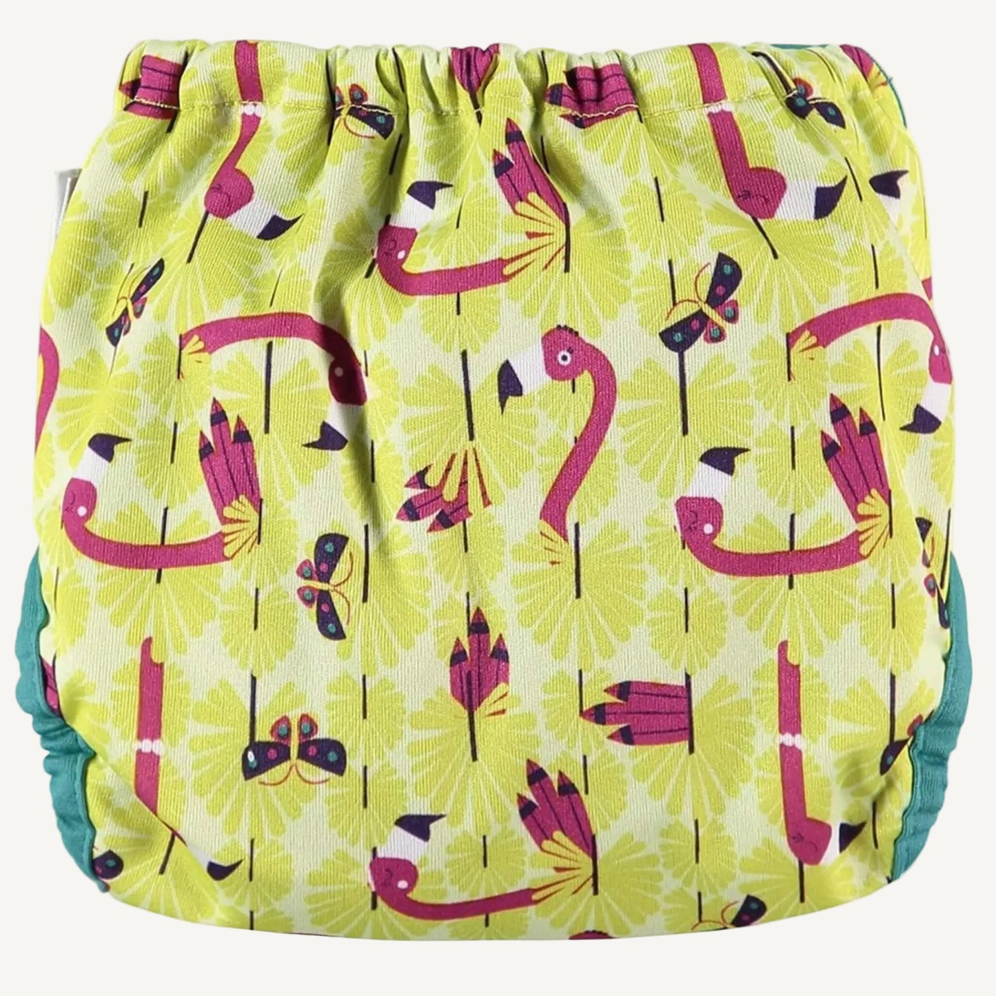 A reusable nappy cover shown from the back with gathered elastic and an all-over flamingo print in yellow, pink and teal tones.